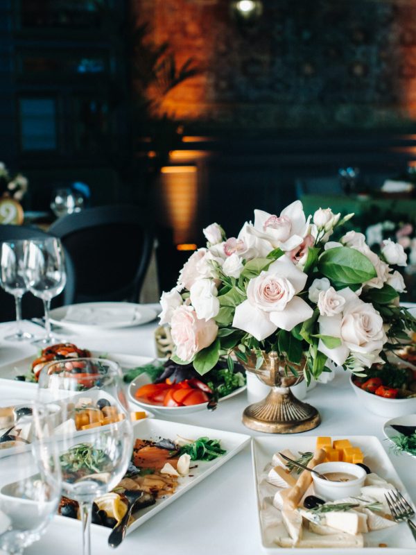 wedding table decoration with flowers on the table in the castle, table decor for dinner by candlelight.Dinner with candles.